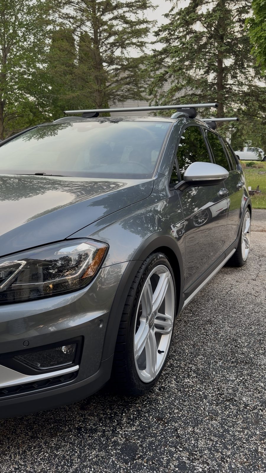 Mirror-gloss paint finish on a freshly detailed grey Volkswagen Golf